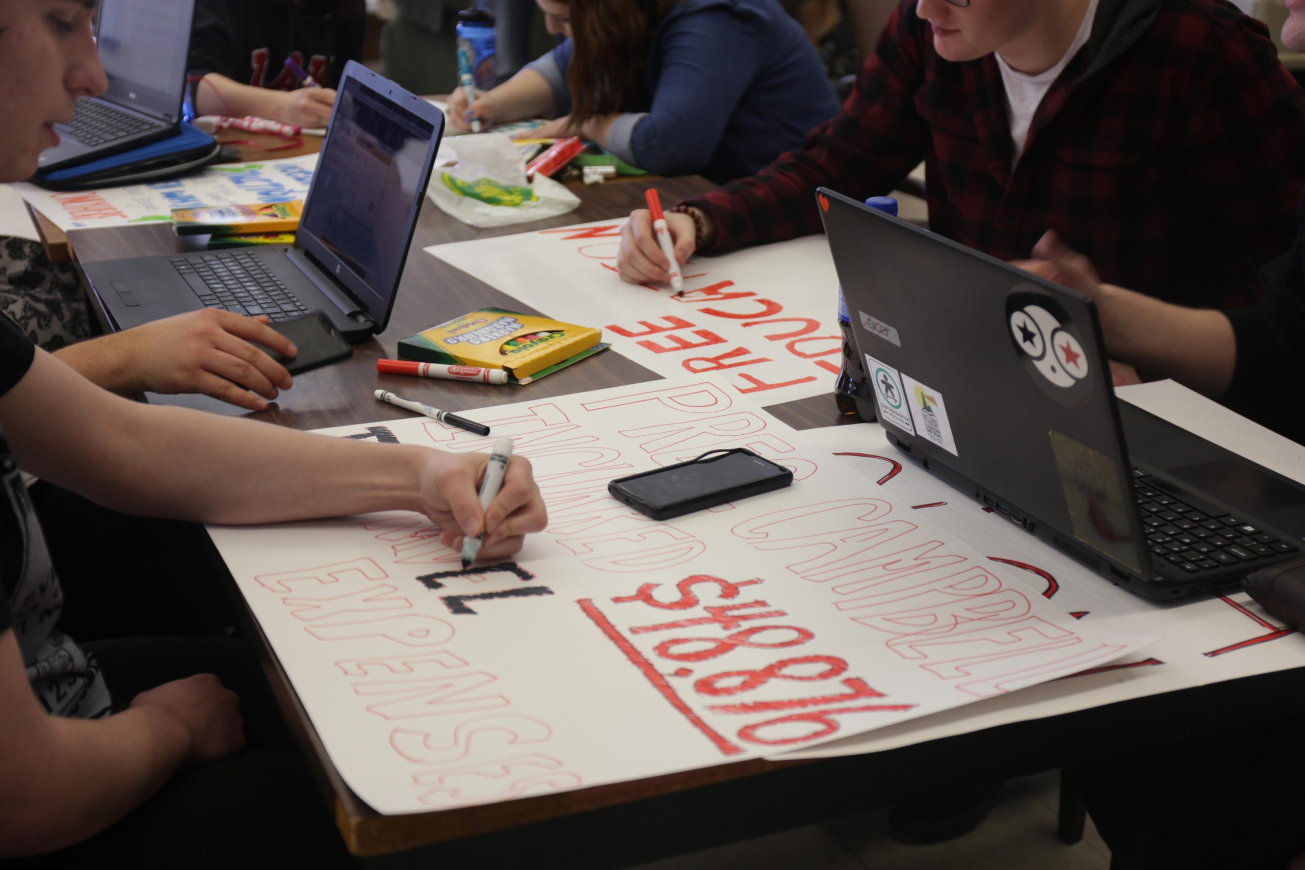 Over 20 students show up to poster making session for tuition reset proposal