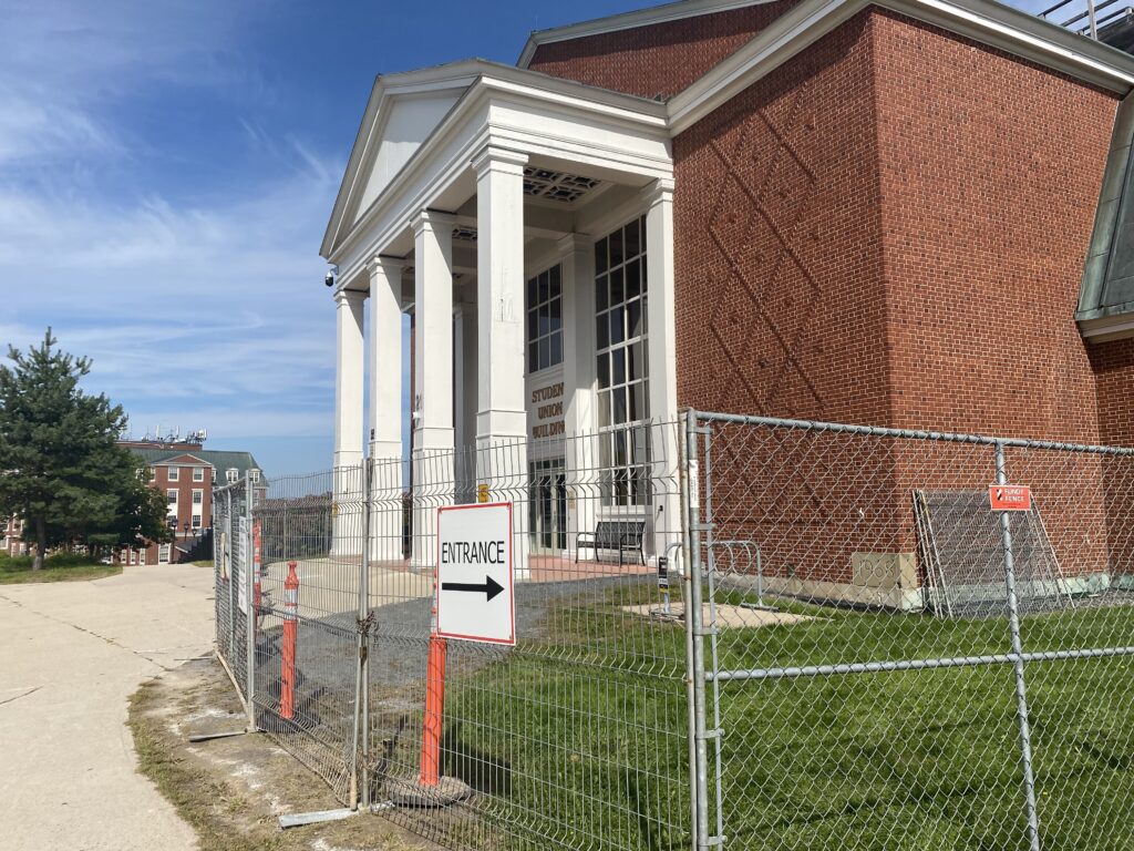 image of front of the Student Union Building blocked by fences due to construction
