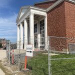 image of front of the Student Union Building blocked by fences due to construction