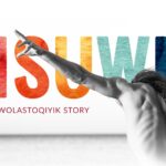 Naked torso of man with arms outspread in front of text "PISUWIN" and in smaller text underneath "A WOLASTOQIYIK STORY"