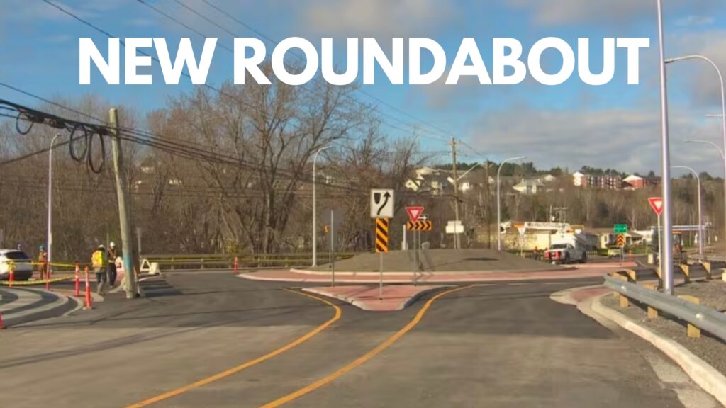 white text "NEW ROUNDABOUT" over image of new roundabout in Fredericton