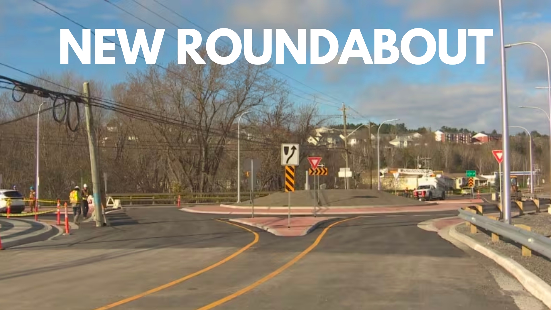 white text "NEW ROUNDABOUT" over image of new roundabout in Fredericton