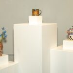 image of three pillars with ceramic vessels on top