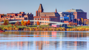 image of downtown Fredericton as seen from the Wolastoq River