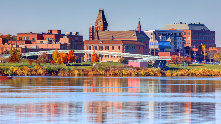 image of downtown Fredericton as seen from the Wolastoq River