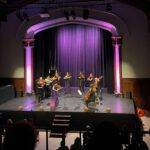 Nadia and the Sinfonia performing on stage